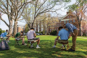 students painting outside